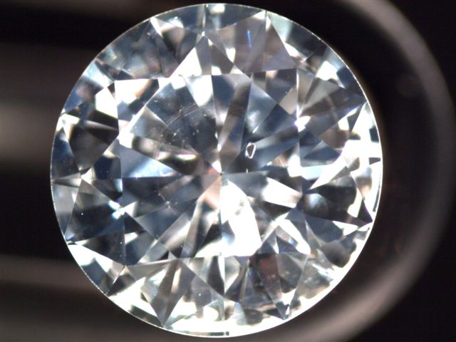 Pit Type of diamond blemish that appears as a tiny opening or indentation on the surface of a diamond.