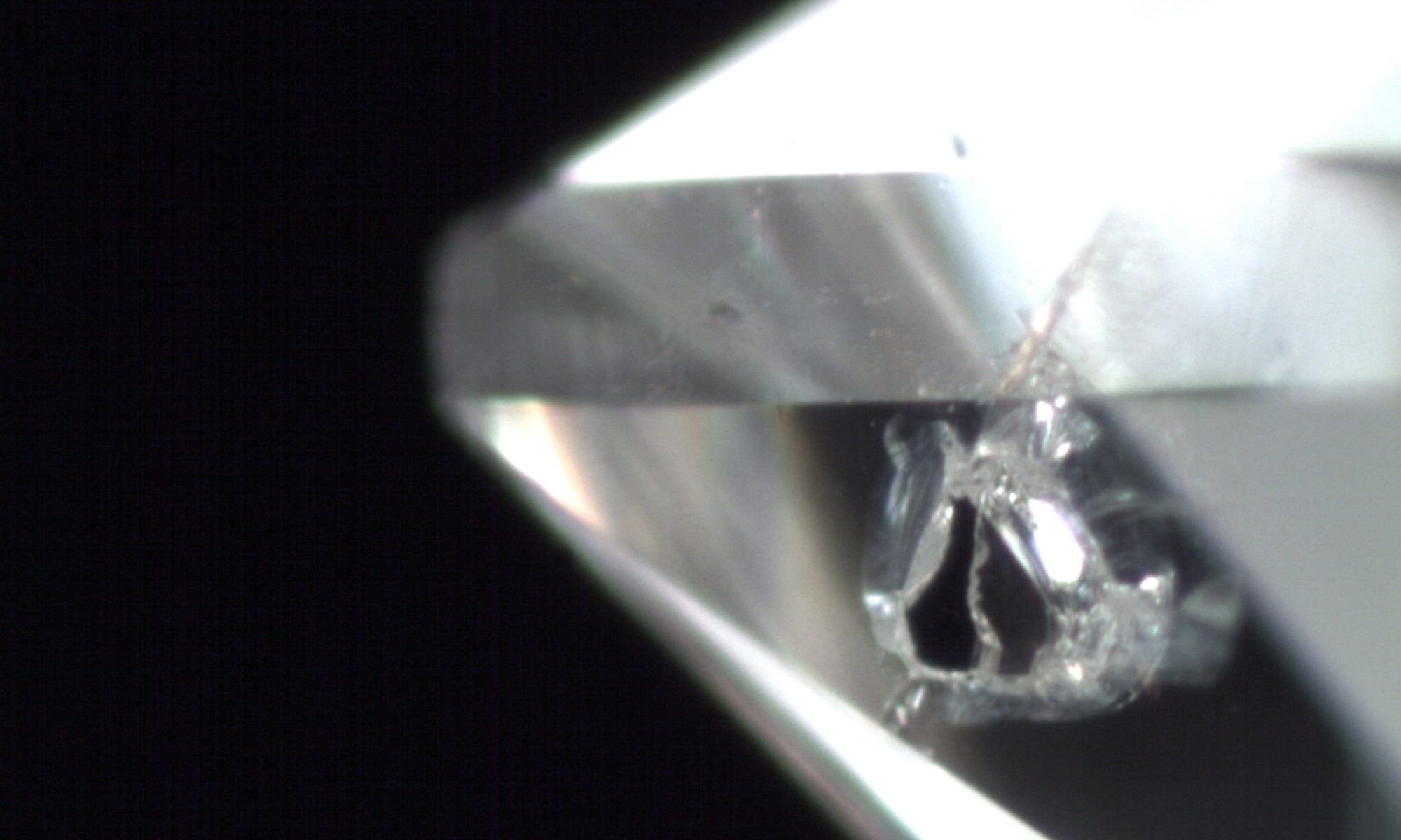 Small black graphite inclusions in a diamond.